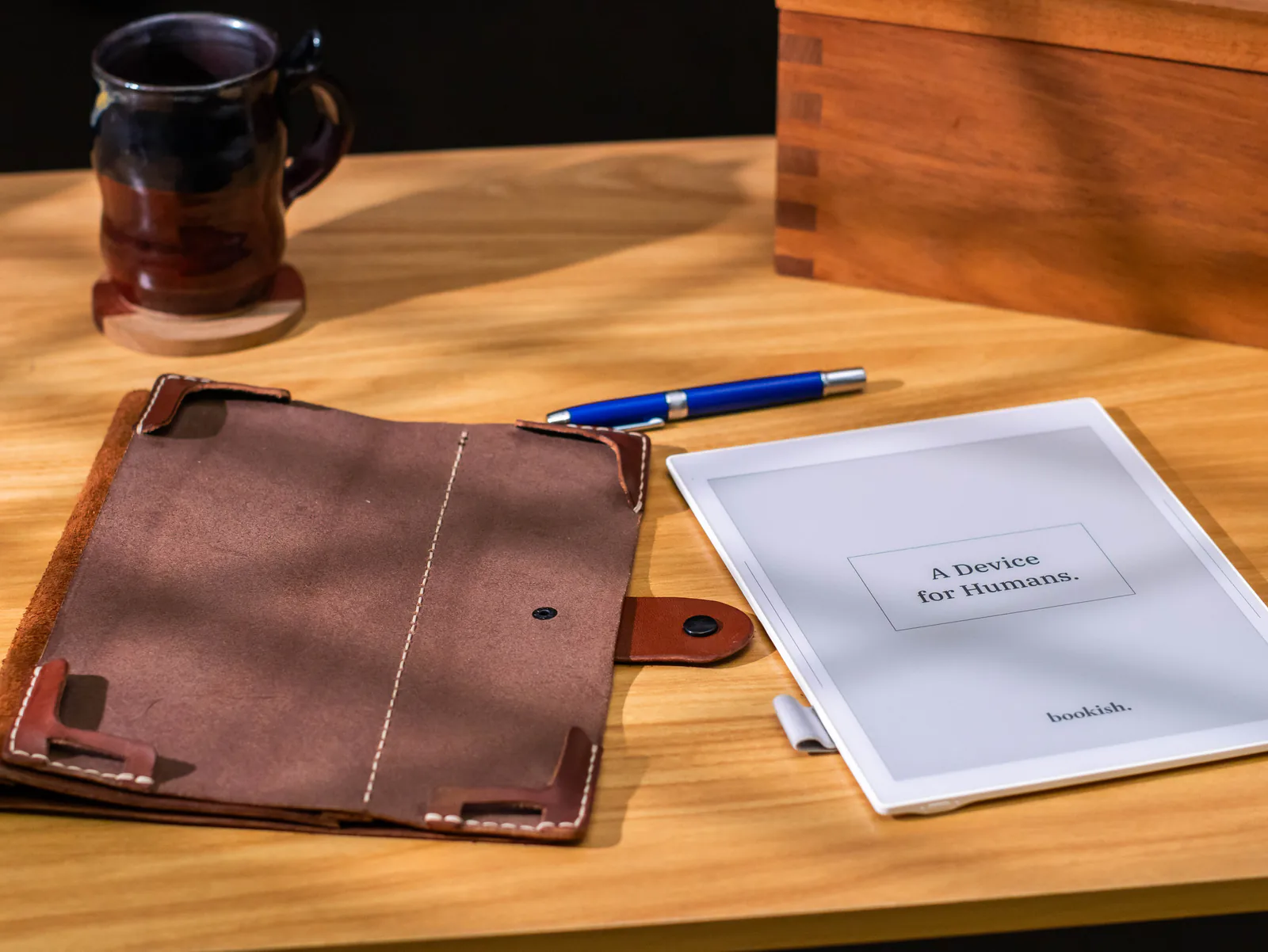 Bookish displaying A Device for Humans beside its leather folio